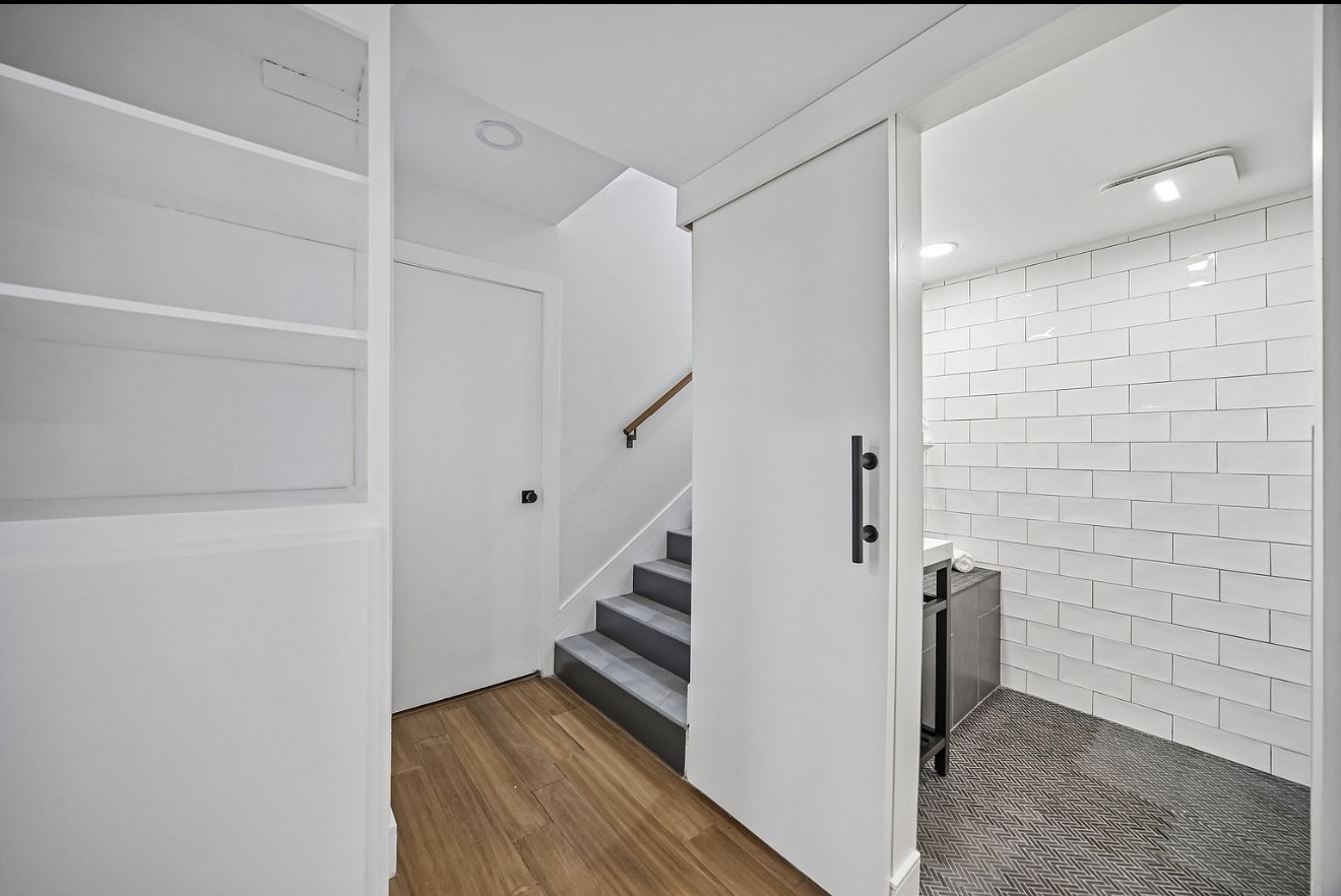 Interior hallway and bathroom entry in the West Hollywood residence