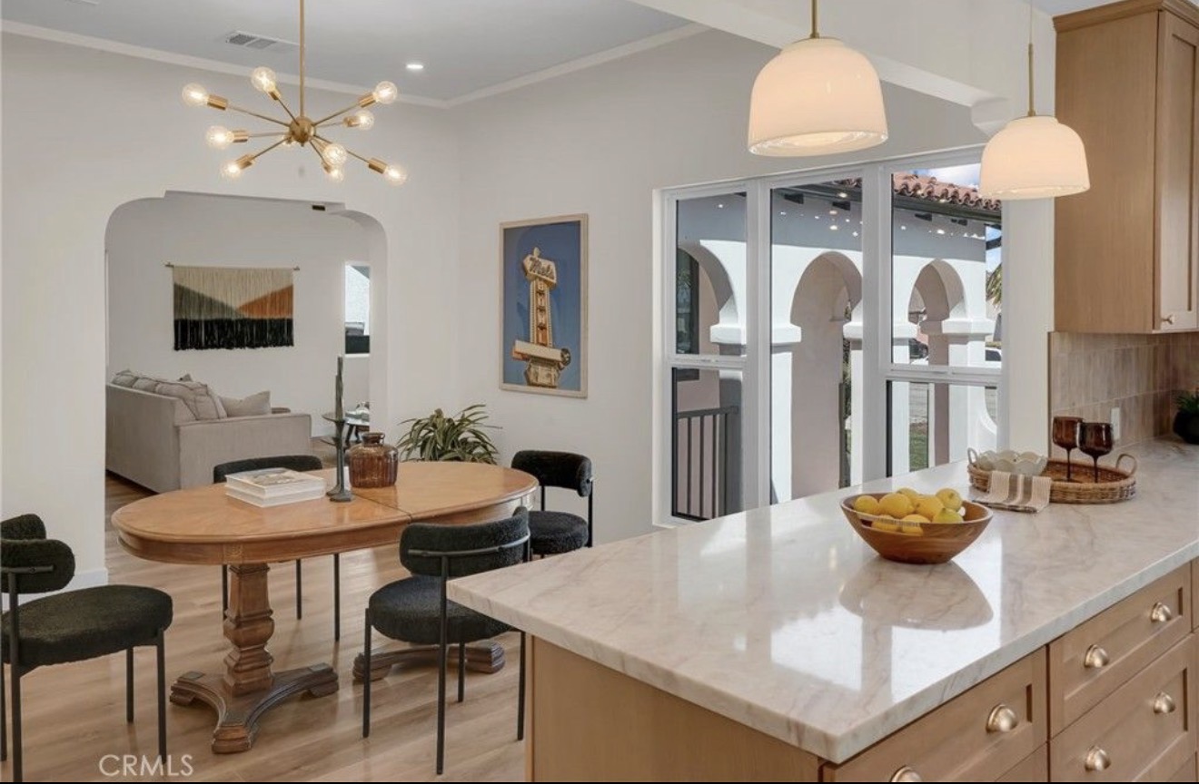 Renovated kitchen with stone island in the Spanish-style residence