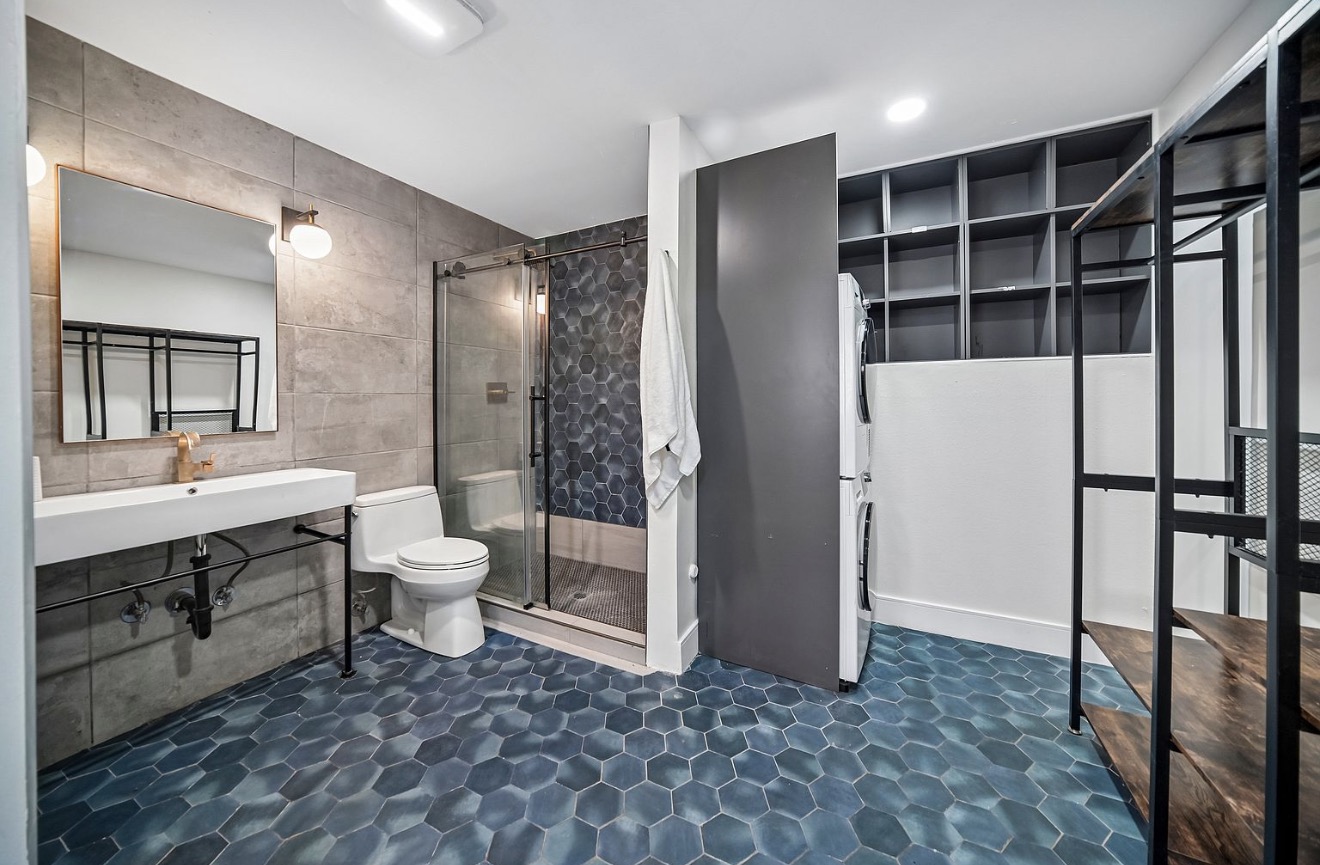 Modern full bathroom with blue hexagonal tile