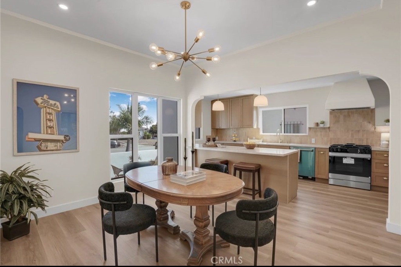 Open dining area and kitchen in the Spanish-style residence